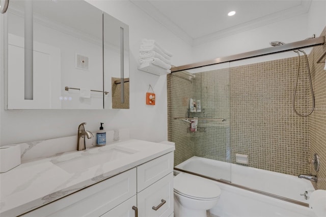 full bathroom with shower / bath combination with glass door, vanity, toilet, and ornamental molding