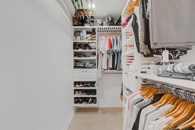 spacious closet with light tile patterned flooring