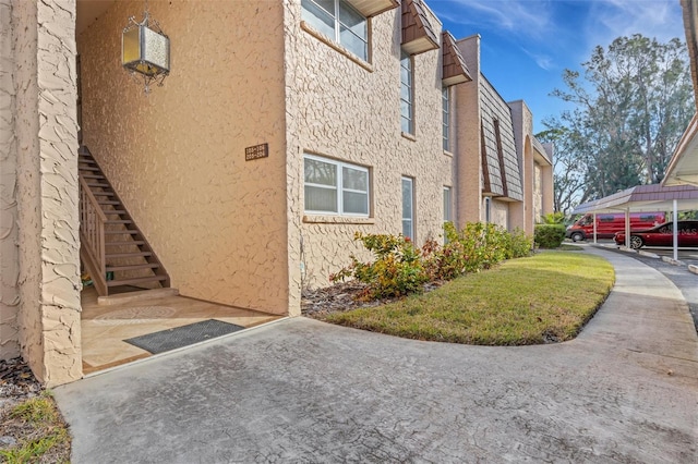 view of property exterior featuring a carport