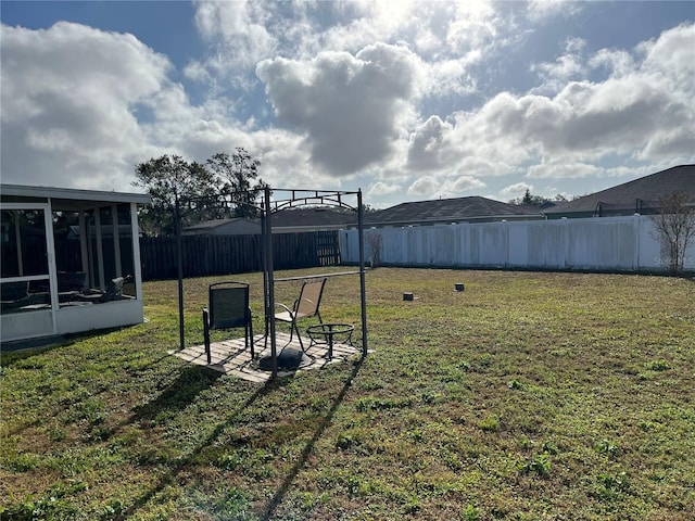 view of yard with a sunroom