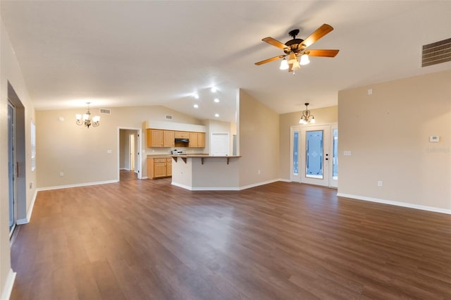 unfurnished living room featuring dark wood finished floors, lofted ceiling, visible vents, baseboards, and ceiling fan with notable chandelier