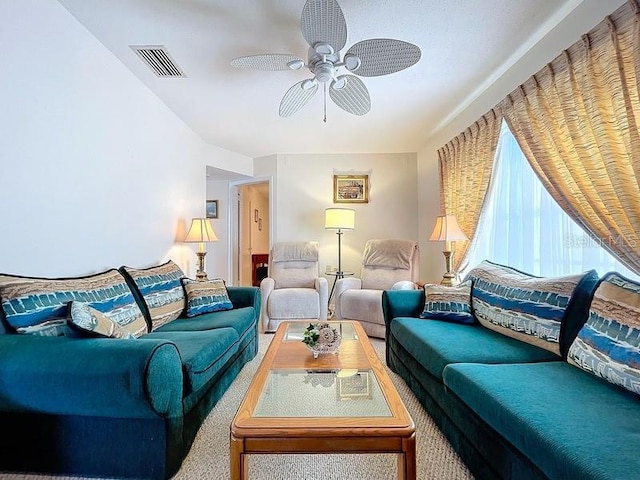 living room with carpet flooring and ceiling fan