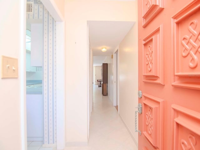 corridor with light tile patterned floors