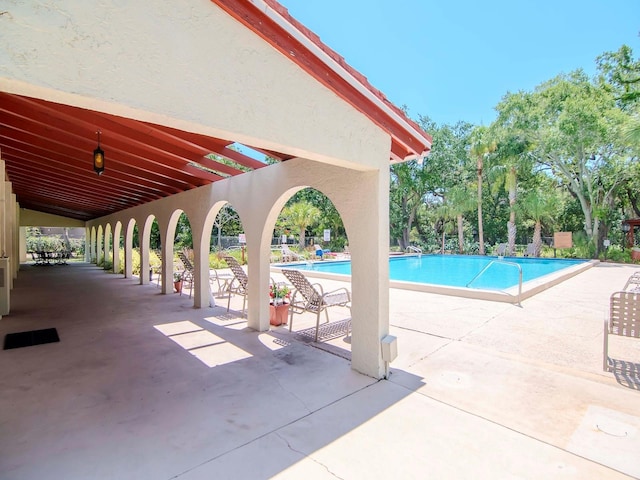 view of pool featuring a patio