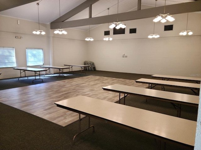 game room featuring high vaulted ceiling, visible vents, and wood finished floors