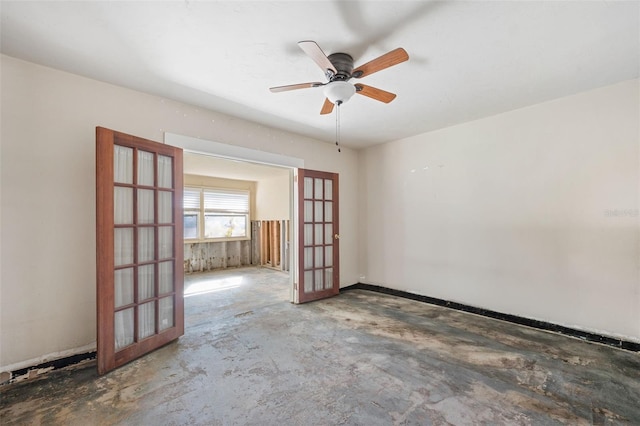 unfurnished room featuring ceiling fan and french doors