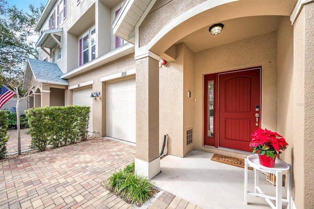 doorway to property featuring a garage