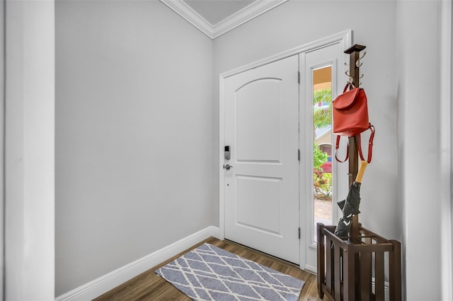 foyer entrance with hardwood / wood-style flooring, plenty of natural light, and crown molding