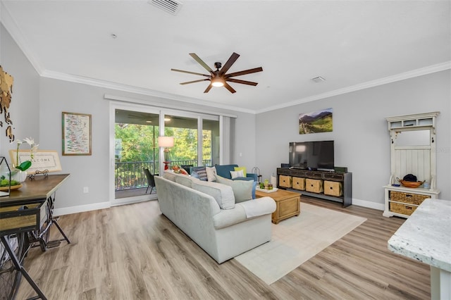 living room with crown molding, ceiling fan, and light hardwood / wood-style floors