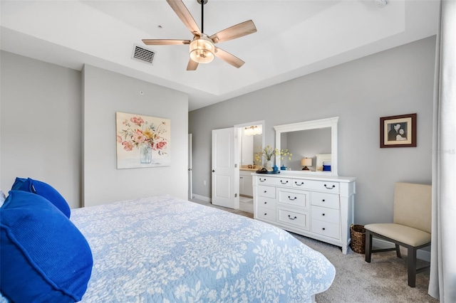 carpeted bedroom featuring ceiling fan and connected bathroom