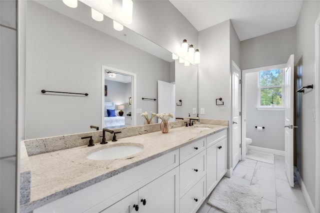 bathroom with vanity and toilet