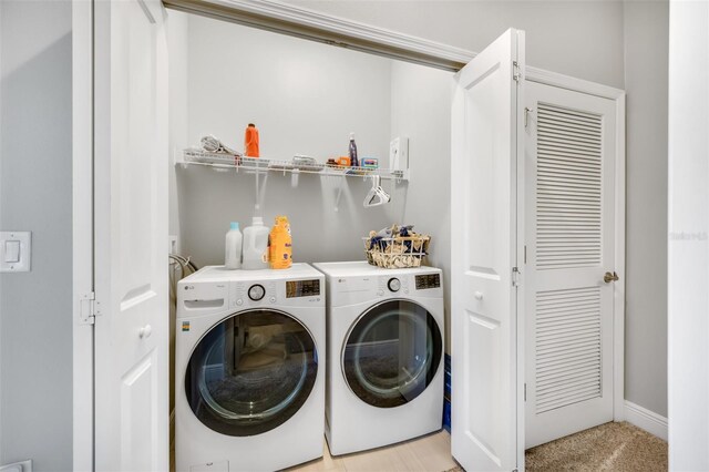 laundry area with washing machine and clothes dryer