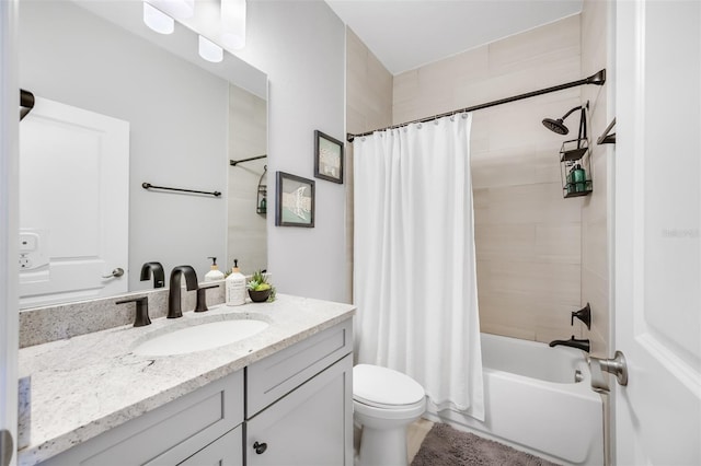 full bathroom with vanity, shower / bath combination with curtain, and toilet