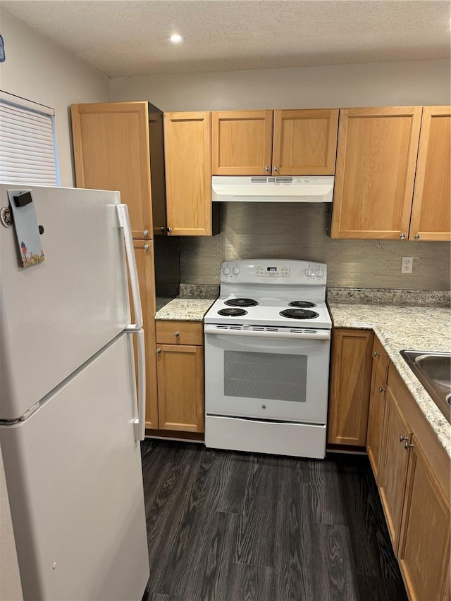 kitchen featuring light brown cabinets, white appliances, sink, a textured ceiling, and dark hardwood / wood-style flooring