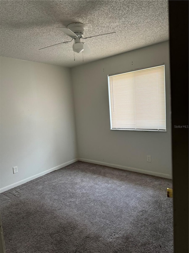 empty room with carpet, a textured ceiling, and ceiling fan