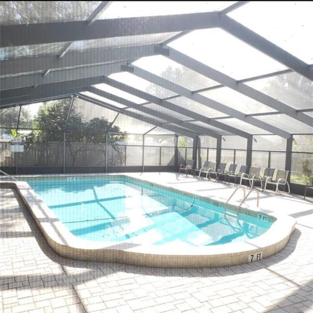 view of pool featuring a lanai and a patio area