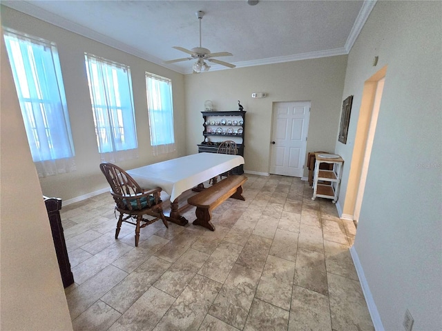 dining room featuring ceiling fan and crown molding