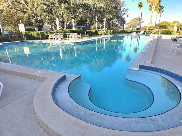 view of swimming pool featuring a patio