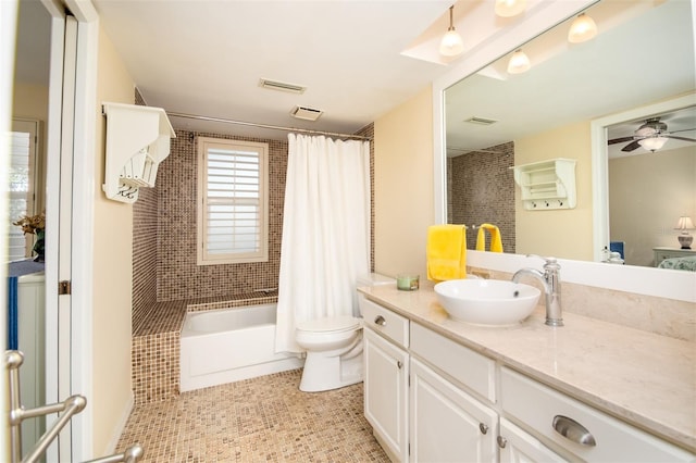 full bathroom featuring vanity, tile patterned floors, ceiling fan, toilet, and shower / tub combo with curtain