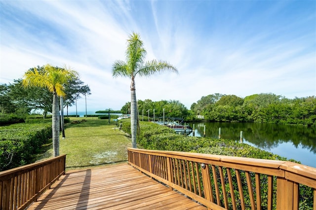 deck featuring a water view and a yard