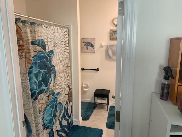 bathroom with tile patterned floors