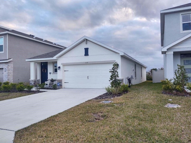 view of front of home with a garage and a front yard