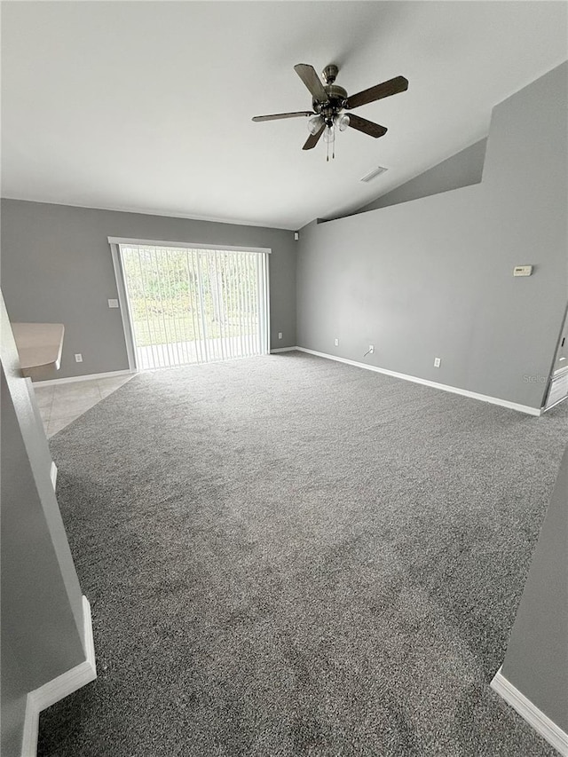 interior space with carpet flooring, ceiling fan, and lofted ceiling