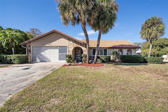 ranch-style home with a front yard and a garage