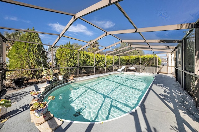 view of pool featuring a patio area and a lanai