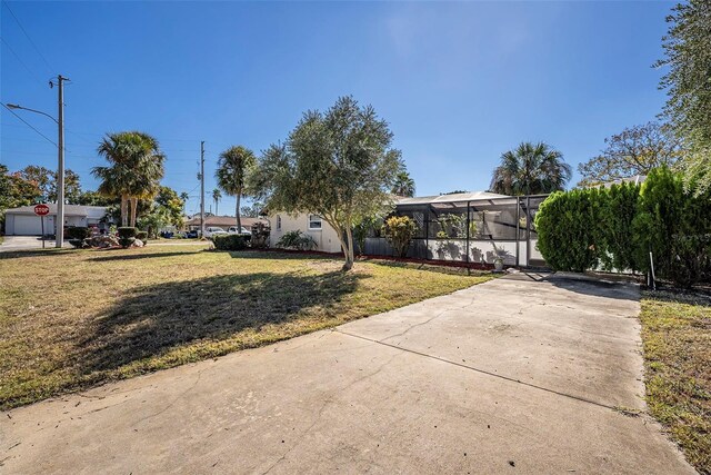 view of yard featuring a lanai