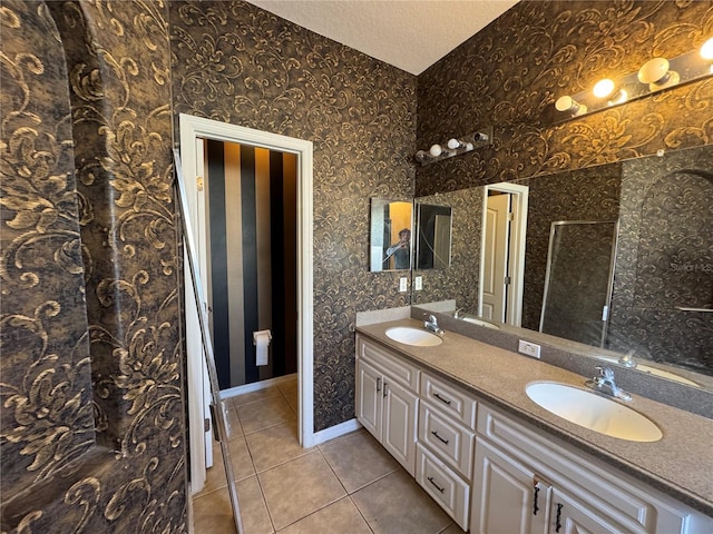 bathroom with tile patterned flooring and vanity