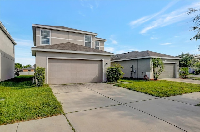 view of front of home with a front yard and a garage