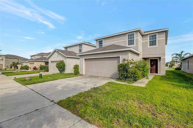 view of front of property with a front yard and a garage