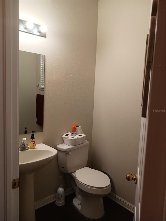 bathroom featuring sink and toilet