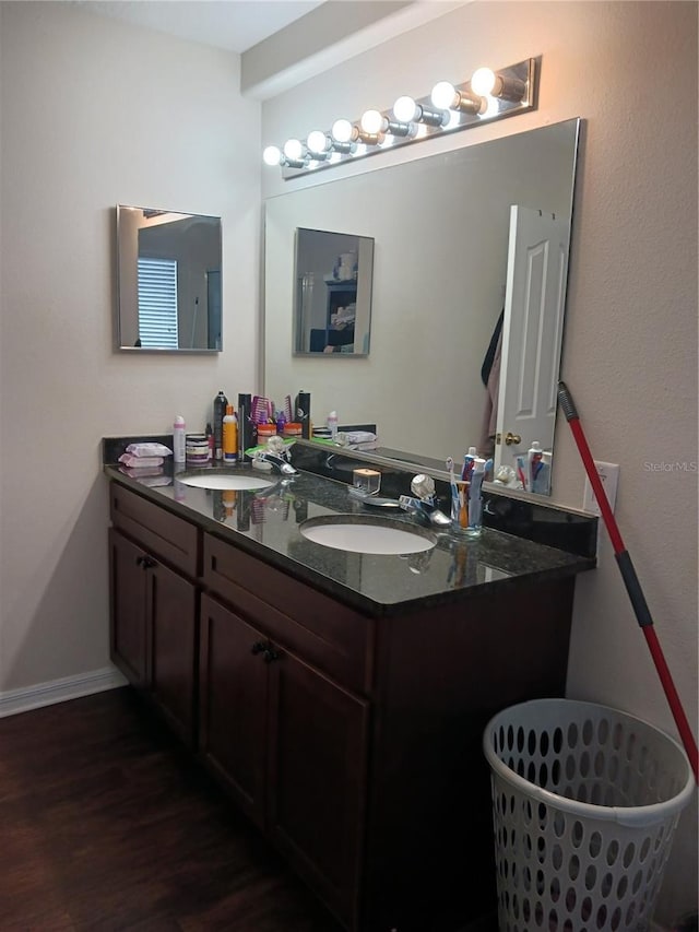 bathroom featuring hardwood / wood-style flooring and vanity