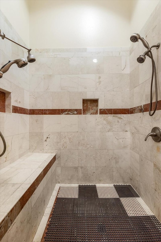 bathroom with tiled shower