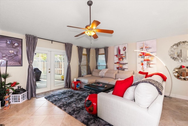 tiled living room featuring ceiling fan and french doors