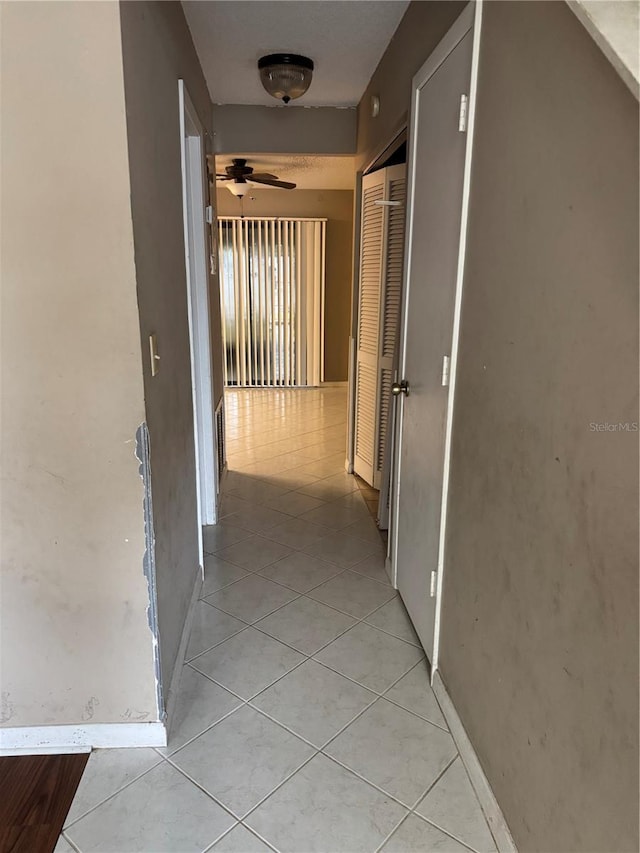 hallway with light tile patterned flooring