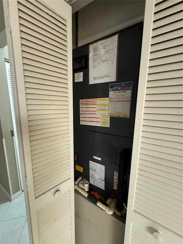 utility room featuring heating unit