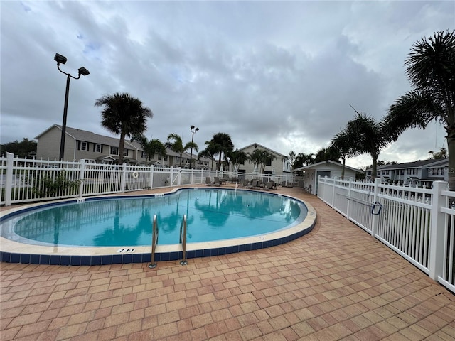 view of swimming pool featuring a patio area