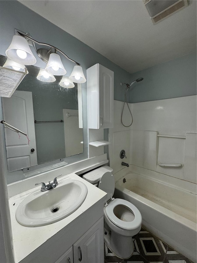 full bathroom featuring shower / bathing tub combination, vanity, and toilet