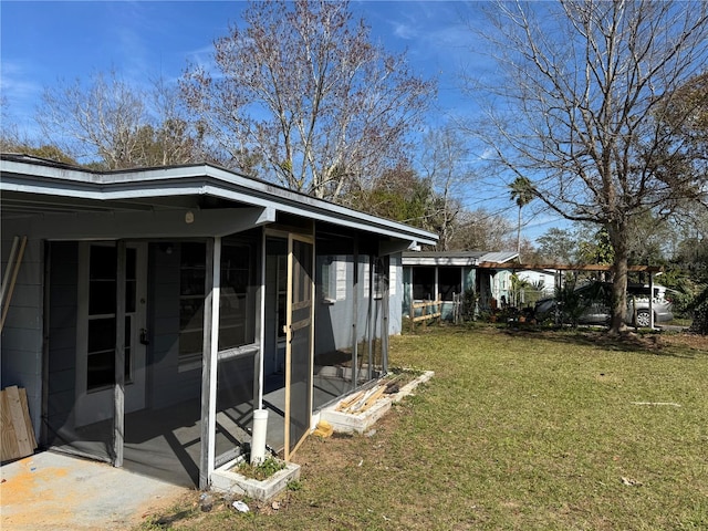 view of yard featuring a sunroom