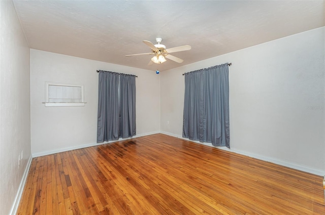 spare room featuring ceiling fan and wood-type flooring