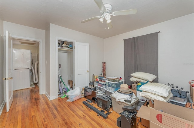 bedroom featuring ceiling fan, a closet, and wood-type flooring