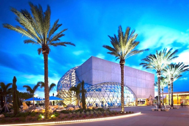 view of outdoor building at dusk