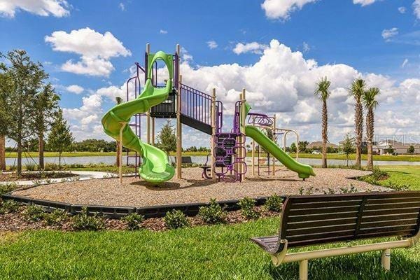 view of jungle gym featuring a water view