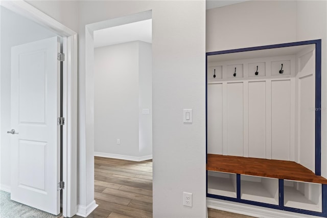 mudroom with light hardwood / wood-style flooring