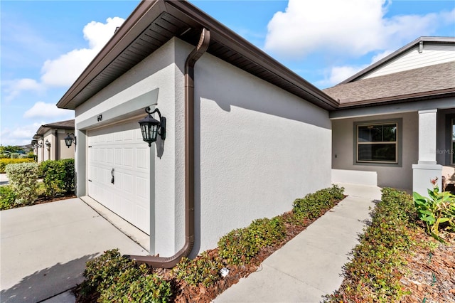 view of side of property with a garage