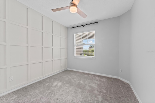 unfurnished room with ceiling fan and light colored carpet