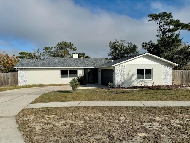 single story home featuring a front lawn